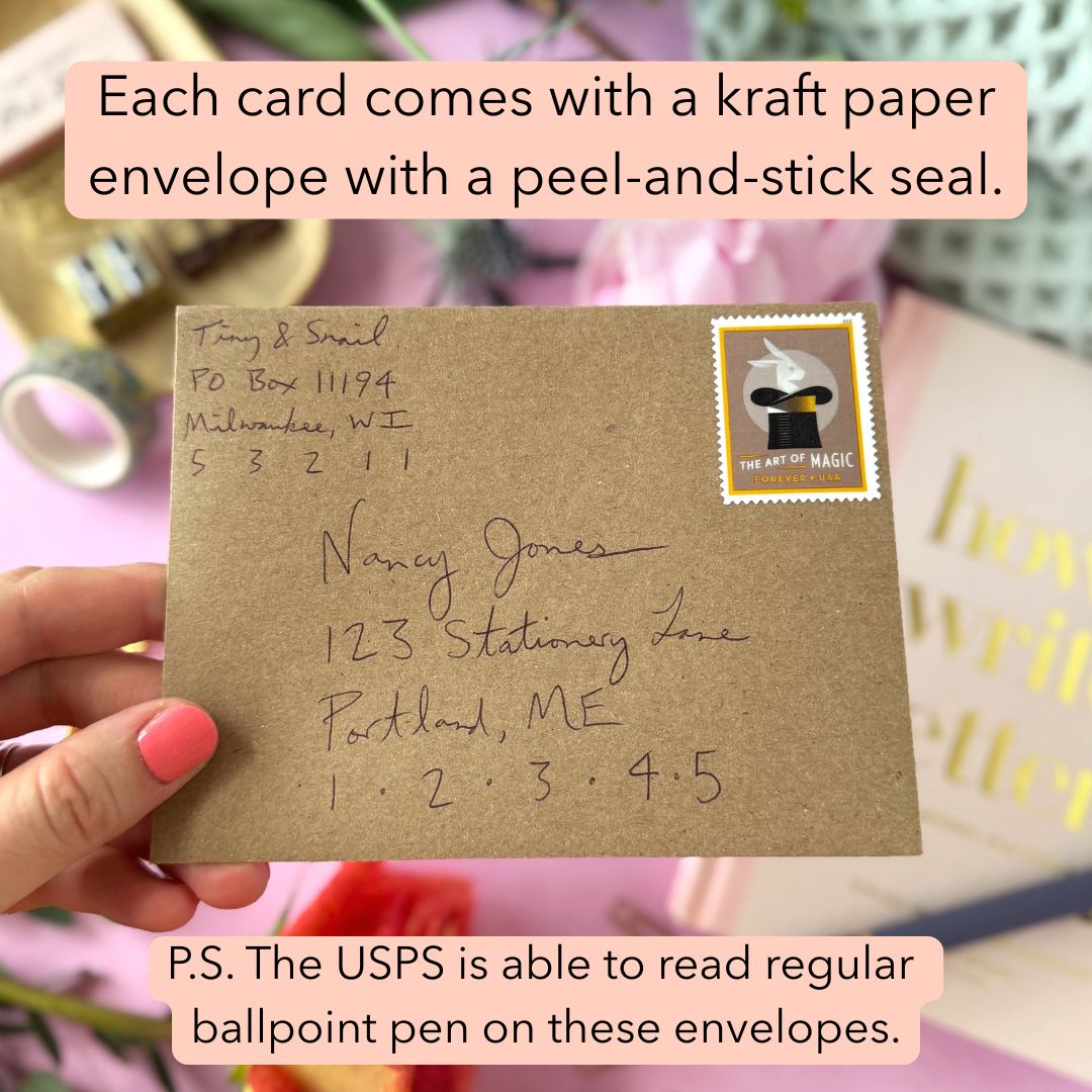 Kraft paper envelope with a stamp and address, held by a hand.