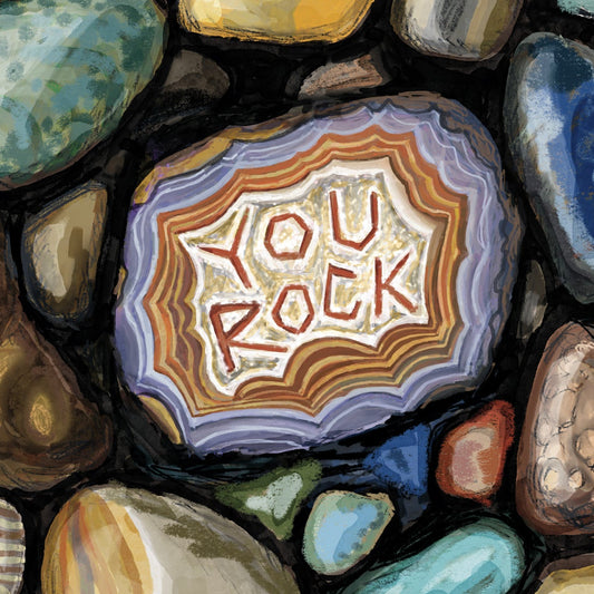 Greeting card close up with pebble design and 'You Rock' text 
